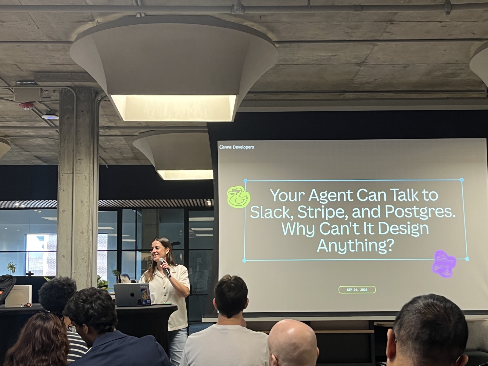 Meredith Hassett presenting Canva MCP on stage at Postman meetup